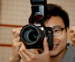 Student taking a picture with a DSLR camera.
