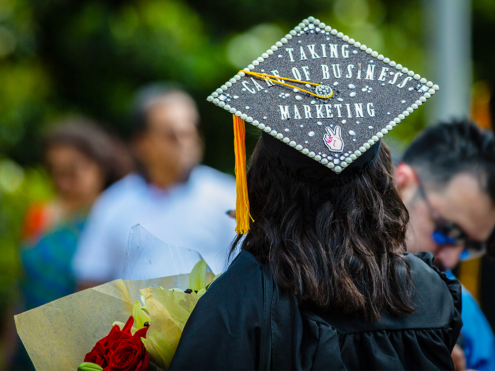 Graduation cap that reads taking care of business