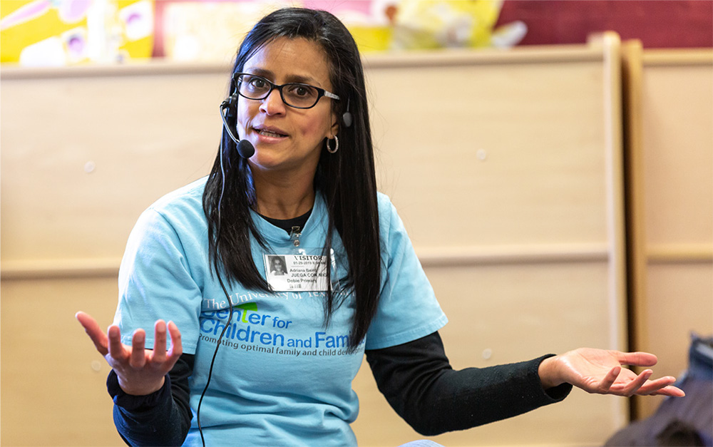 Adriana Villa Baird gestures while teaching