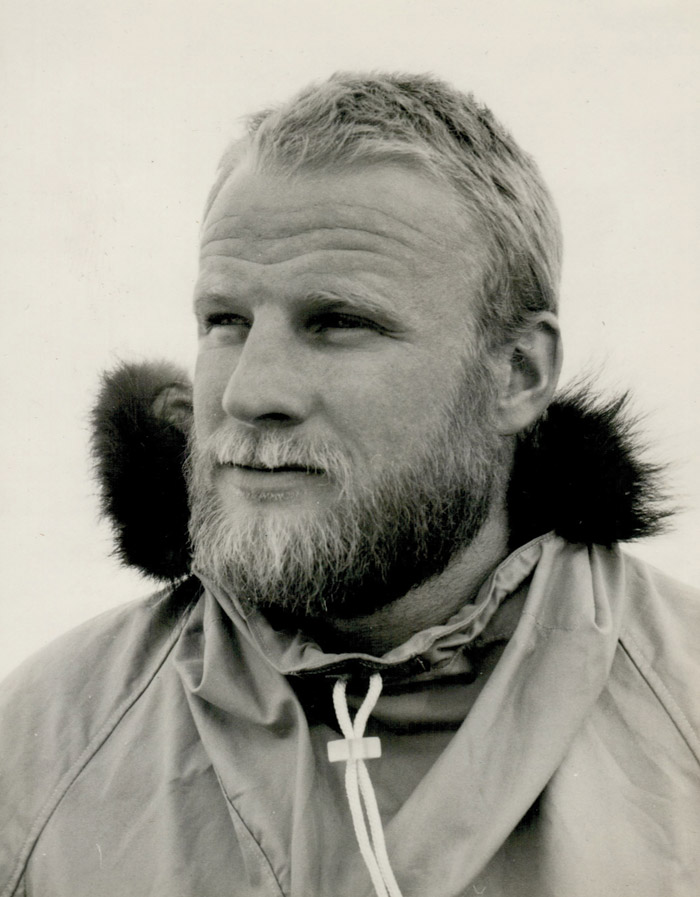 A black and white photo of a young Robert Rurford wearing a coat with a fur-lined hood.